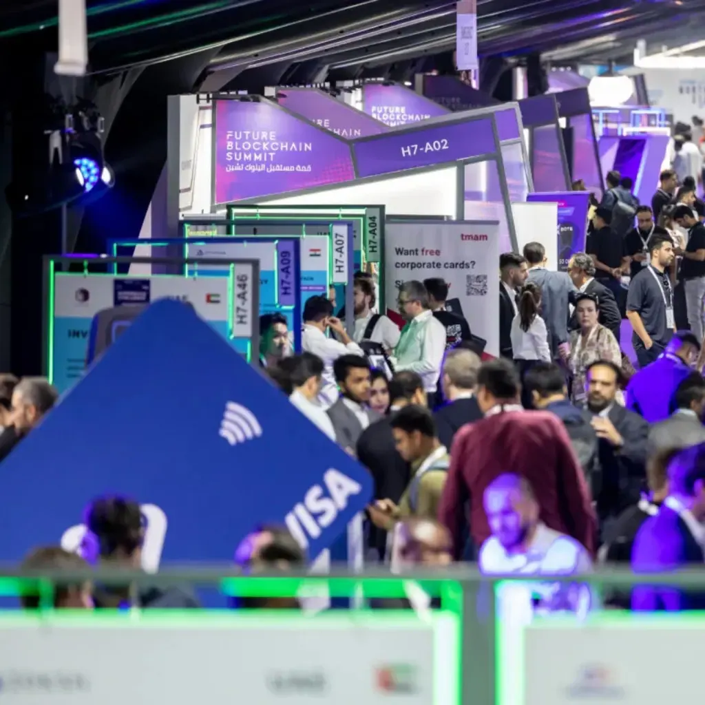 Founders and visitors filling an aisle of the GITEX exhibition halls