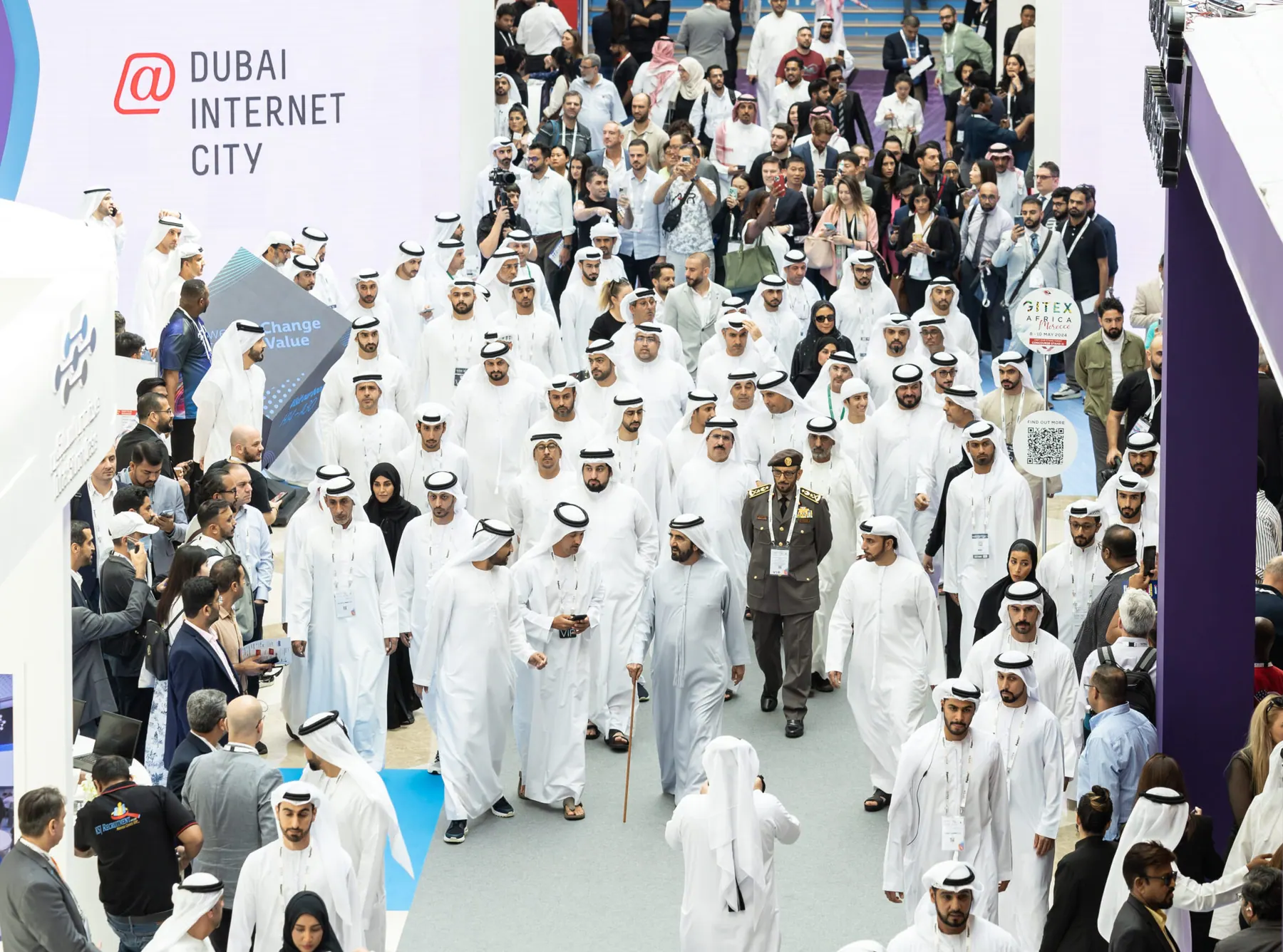 An Emirati delegation touring the show floor past the Dubai Internet City stand